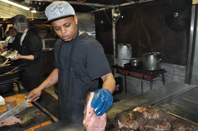 Darrius Breveard dished out sirloin tip steaks to hungry fair-goers.
