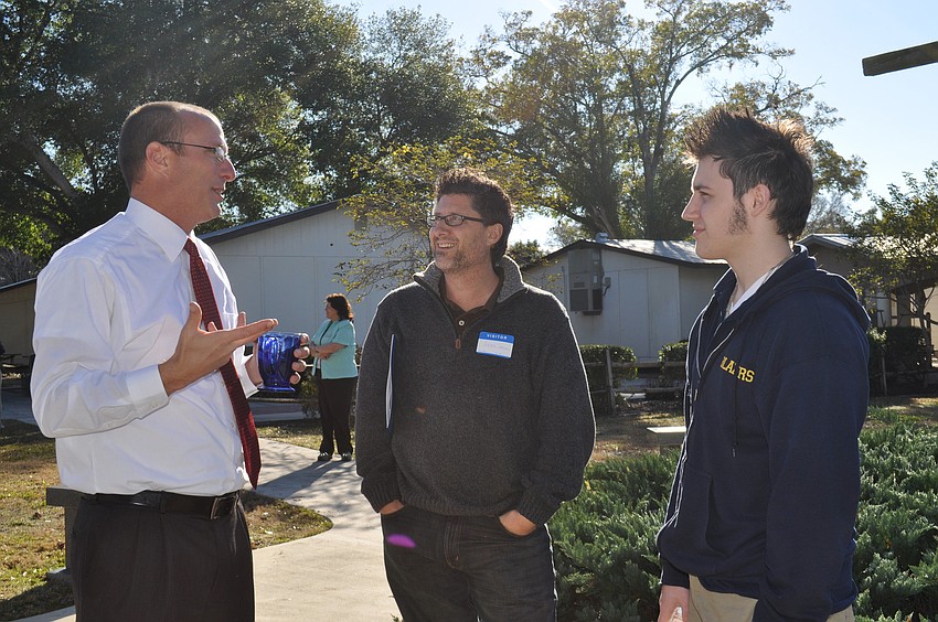 Superintendant of Sarasota Christian School, Jeff Shank, with Pastor Roger Shenk and his son, Josiah.