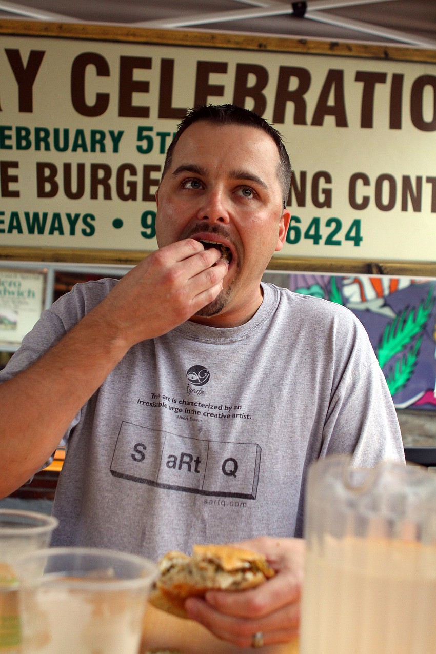 Second place winner, Chris DeLeonardo, tries to win the tie-breaker round during Veg's First Annual Veggie Burger Eating Contest on Saturday, Feb. 5 outside of Veg.