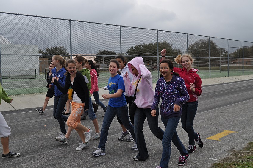 Mia Schilling, Caitlin Gish, Jenn Jaso, Baylee Cooper, Kaley DeLeon, Camille Armington, Tristan Parsons, Kate Sundberg and Andrielli Papa dance their way around the track.