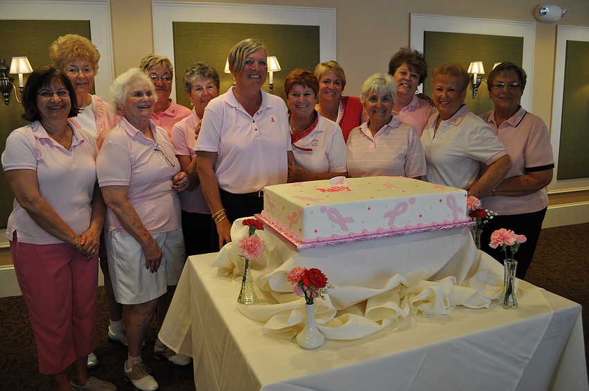 The event's organizing committee made sure to get a picture with the Rally for the Cure cake.