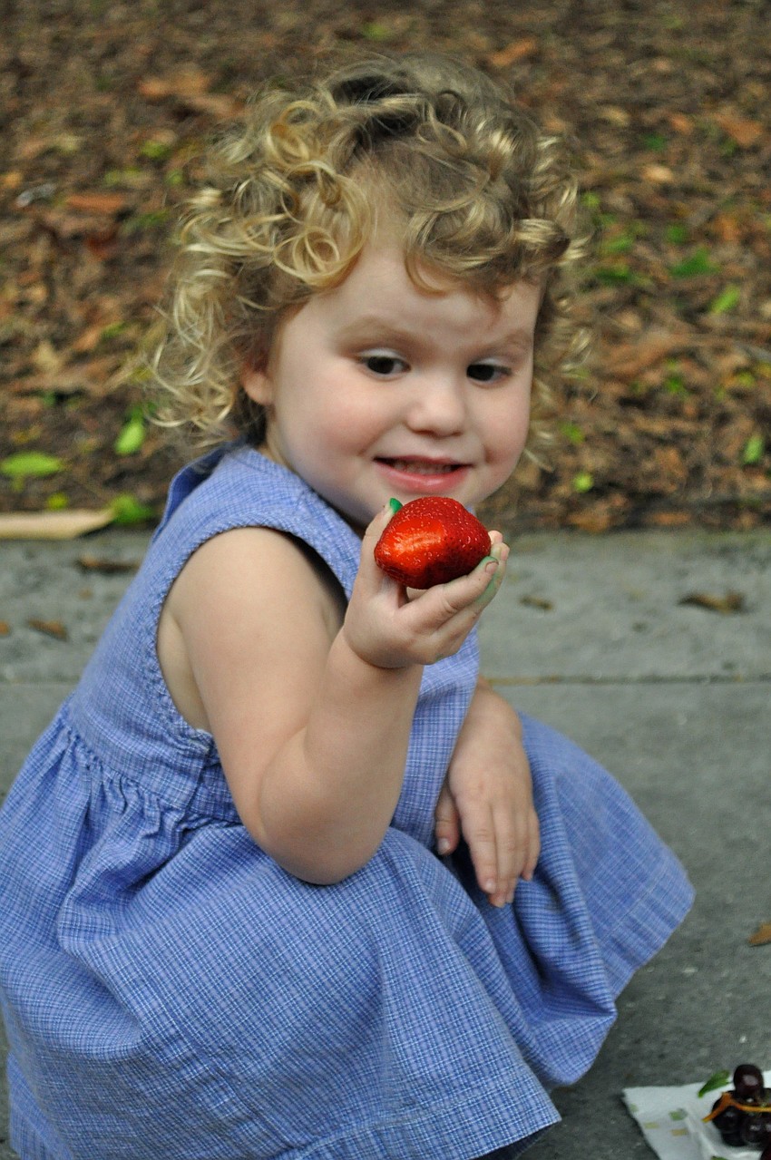 Sofia Rae Rice prepares to chow down on a juicy strawberry.