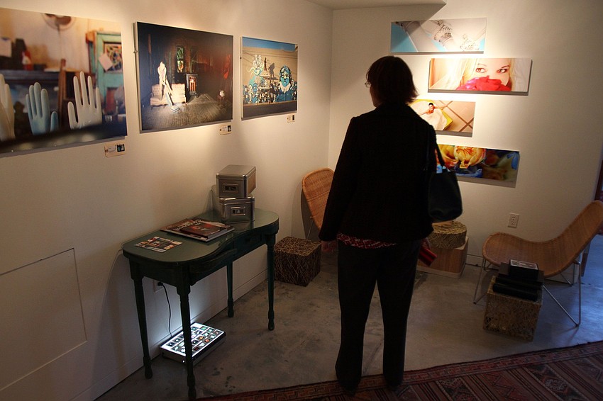 Nancy Dudek looks at Shelia Simmington's work inside Simmington's new studio on Thursday, March 3 during Rosemary Rising.