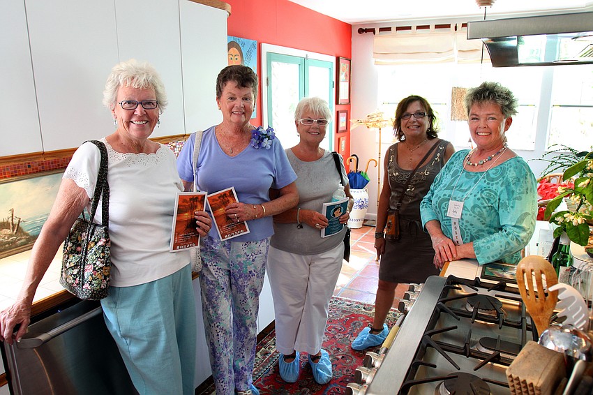 Ann Robinson, Margaret Meissner, Huguette Jodoin, Louisa Kaplan and Kathy Caserta inside the kitchen of the Pressly home on Saturday, March 5 during the Home and Garden Tour on Longboat Key.