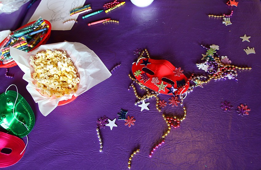 The coloring table inside Voocaray on Sunday, March 6 during the 1st Annual Sarasota Mardi Gras that was held at Voocaray in Gulf Gate.