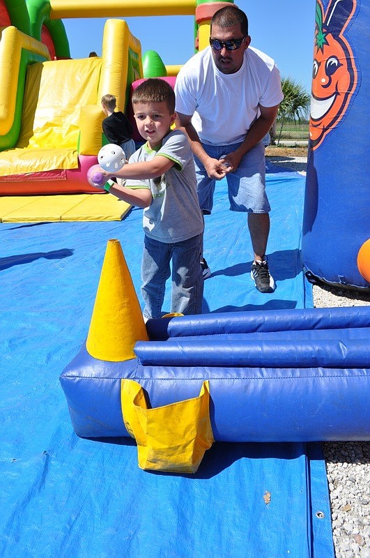 Sammy Laporta, 5, got some batting instruction from his dad, Sam.