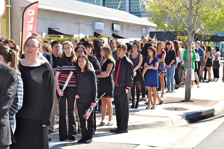 The community pays its respect to the two siblings killed in a car crash Sunday.