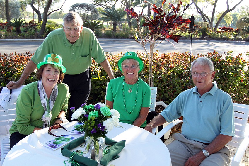 Eileen and Art Lyons pose with Barbara and Gene Kucharski on Thursday, March 17 at Longboat Key Club's outdoor Harbourside dining patio.