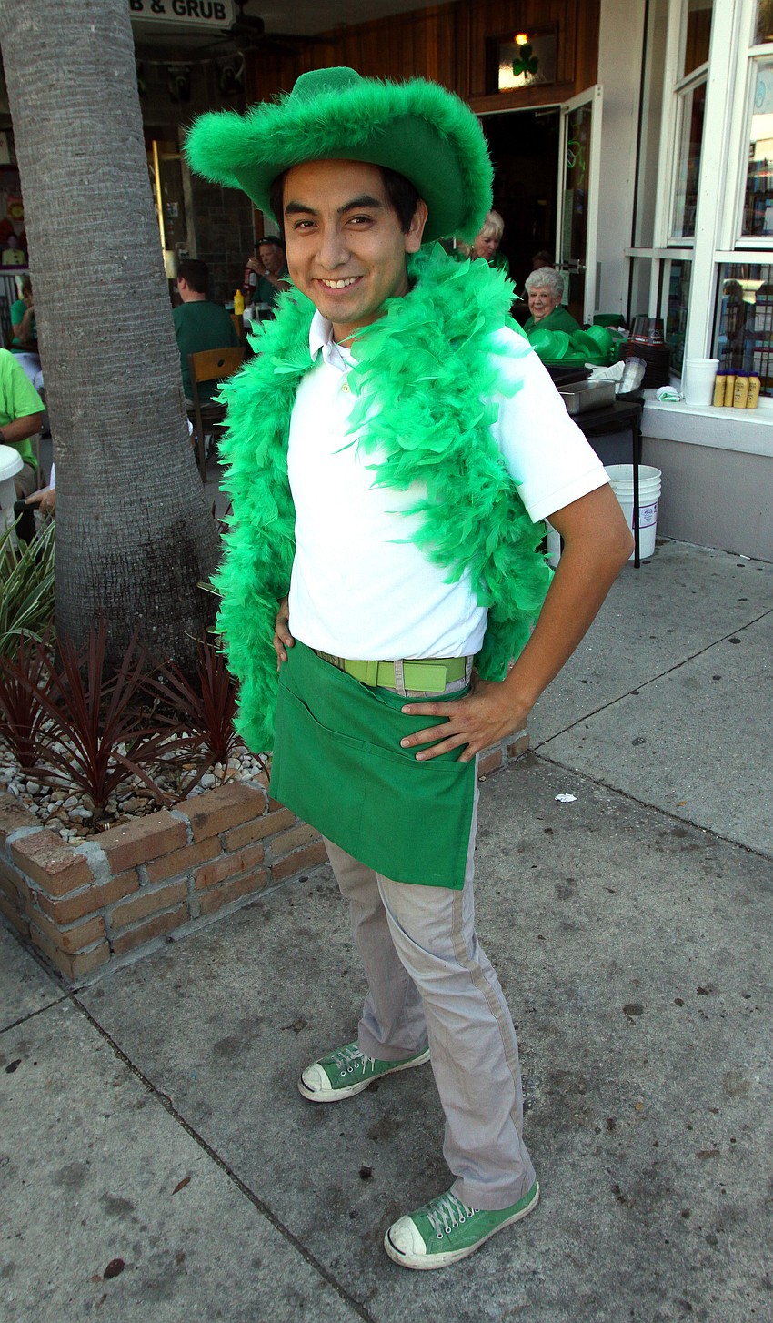 Edwin Velasco dressed up for the occassion while he worked the St. Patrick's Day party at Lynches Pub.