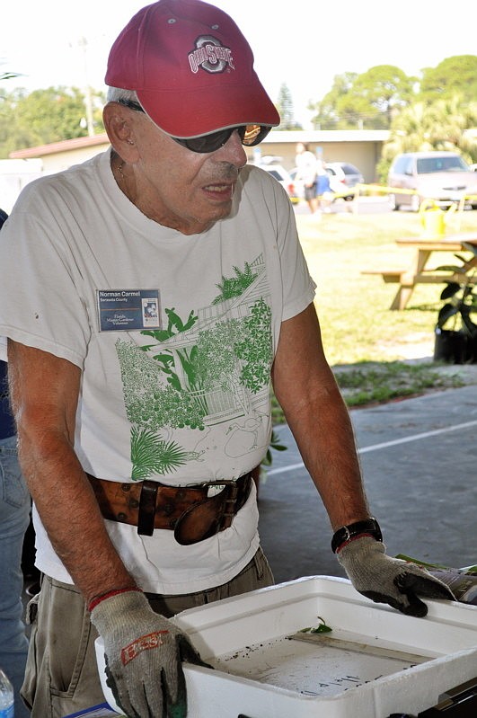 Dorman Carmel takes a break from hauling plants.