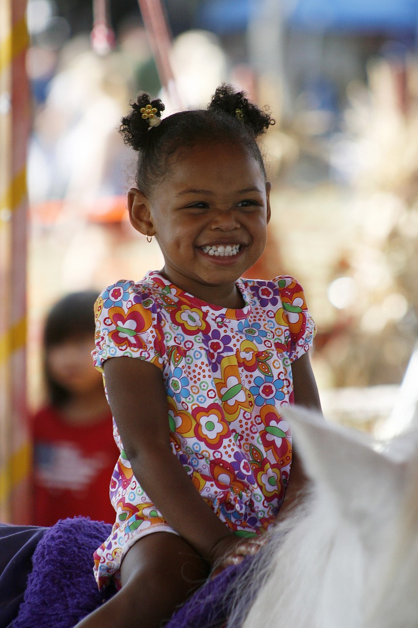 Heaven Harris, 2, had a blast on the pony ride.