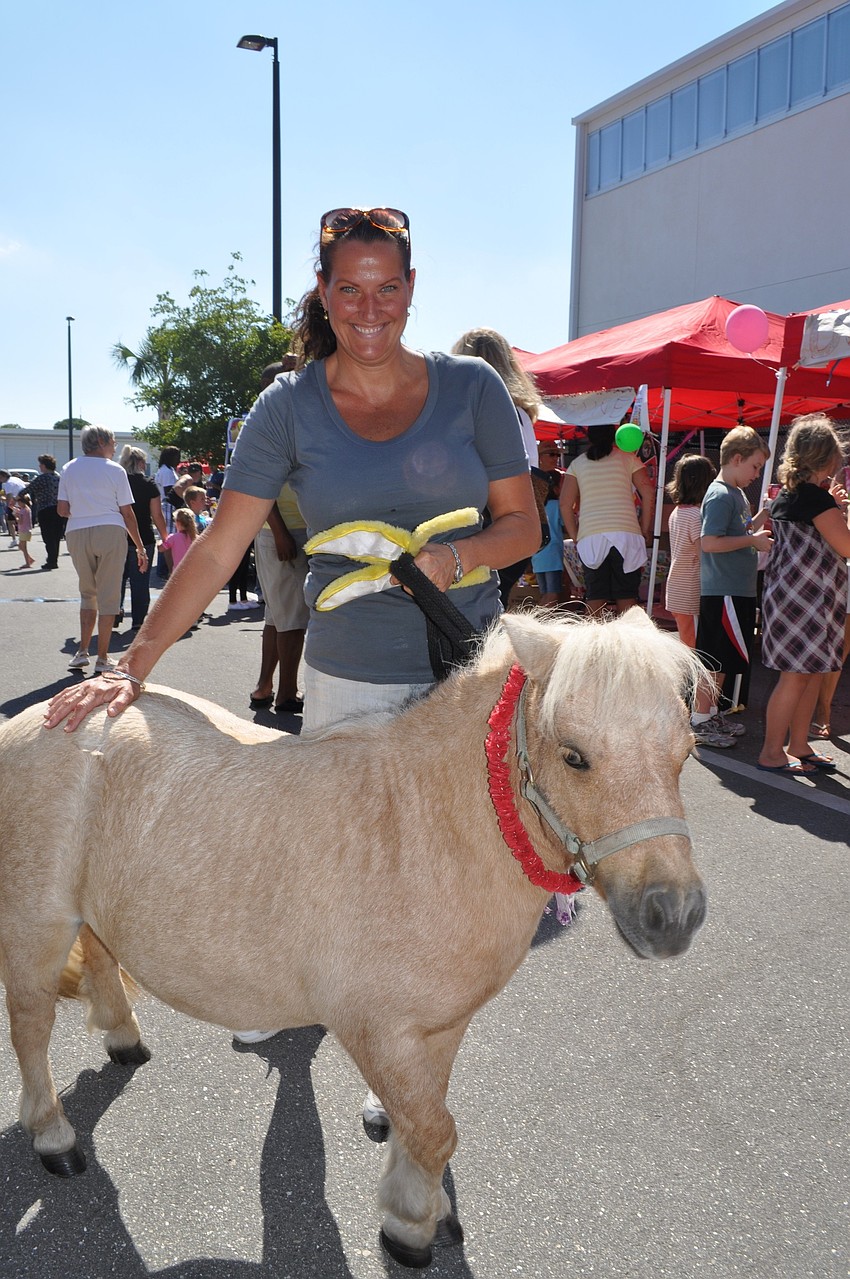 Kim Gillette with her aunt's miniature horse, named Pearly Sue