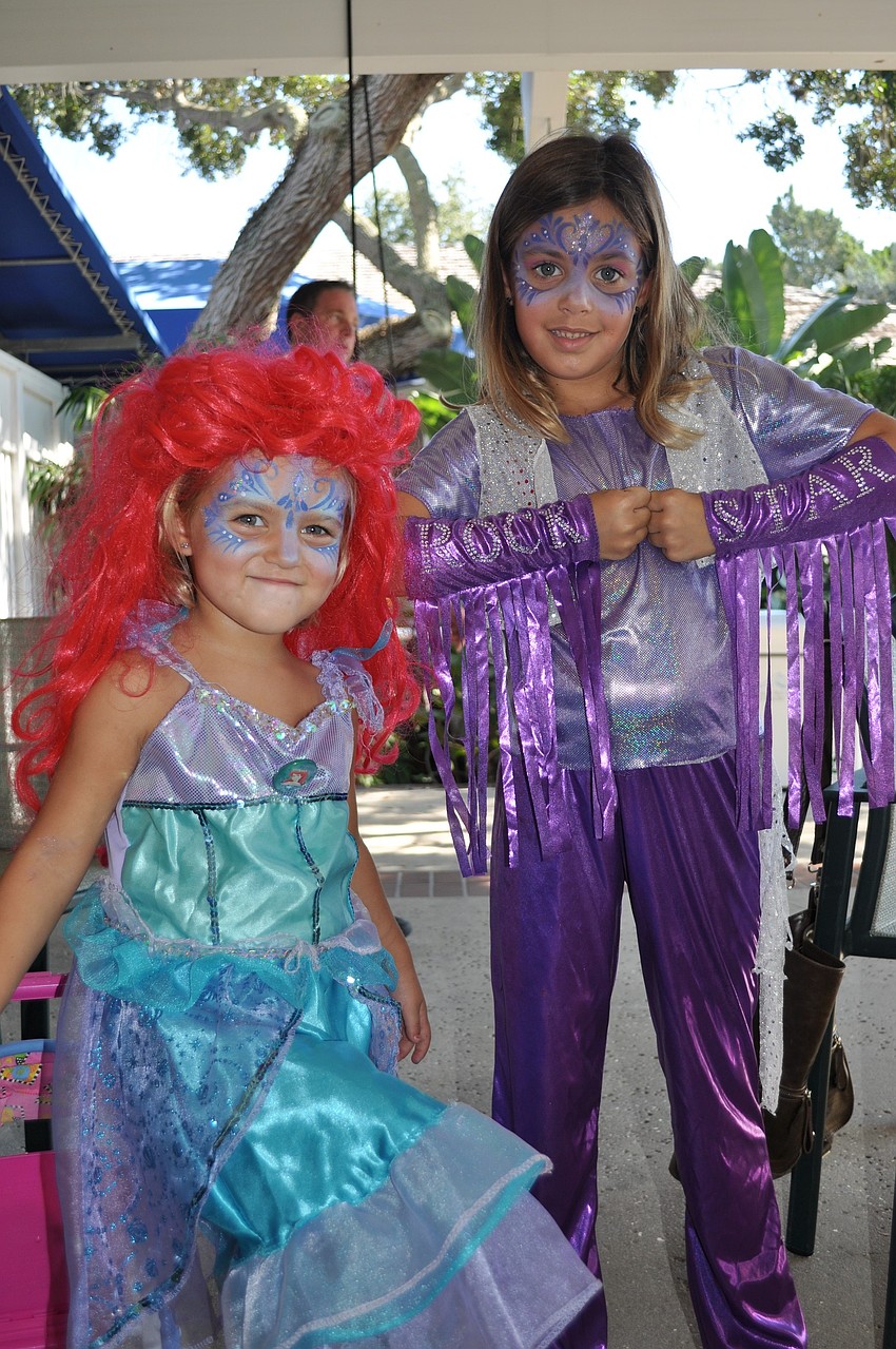 Saylor Hann, age 4, as Ariel from The Little Mermaid and her sister, Siesta, age 6, looking cool in a 