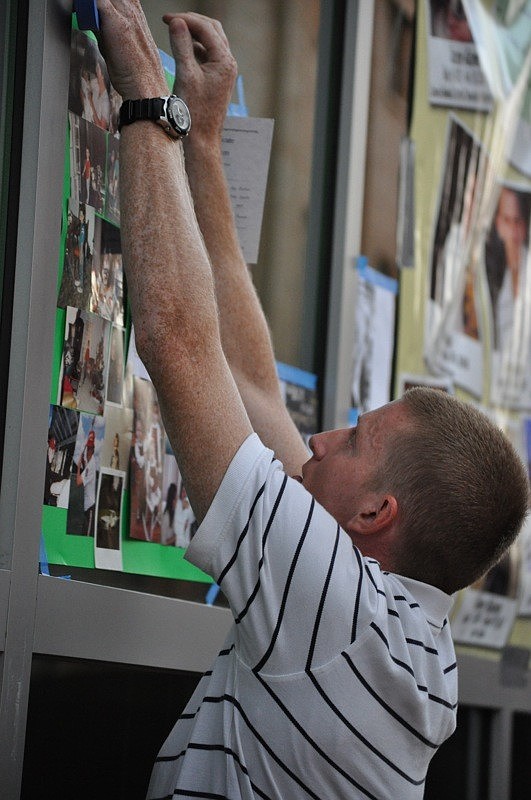Brian Drymon, 27, displays a collage of his best friend, Chris Barnett, who died of an overdose just more than a year ago.