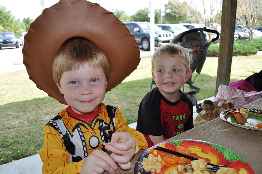 Emerson Ieige, 3, and Connor Christenson, 4, ate a lunch of macaroni and cheese.