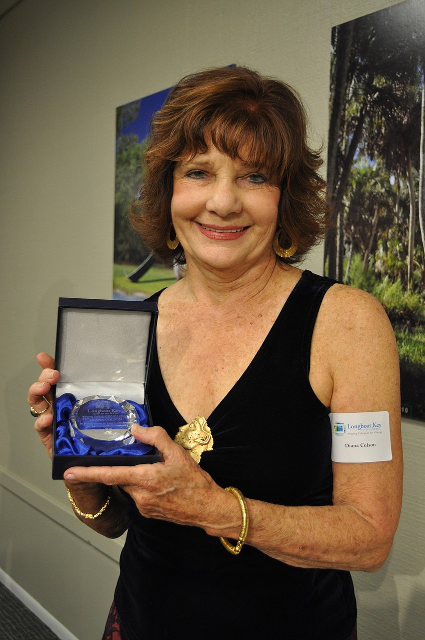 Diana Colson displays her award.