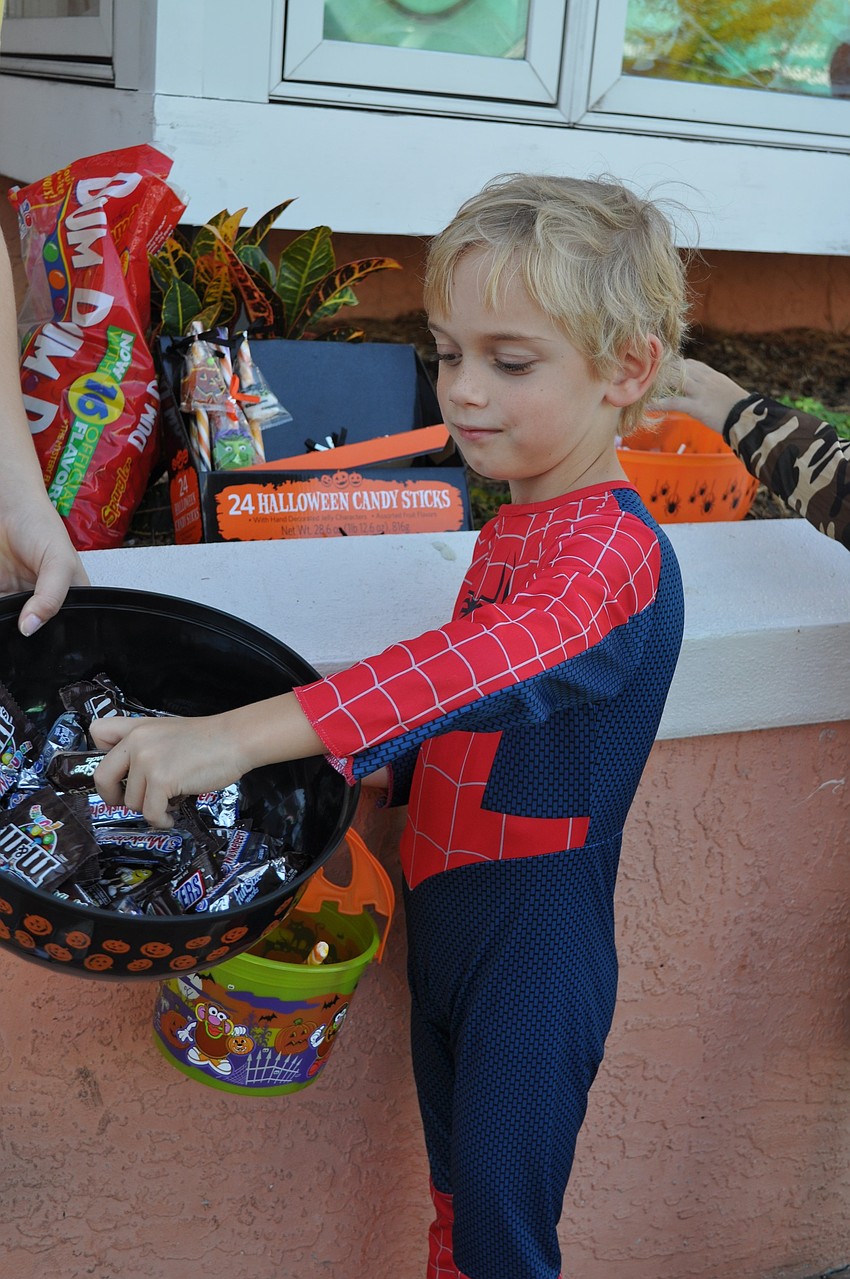 Axel Boyle reaches for a sweet treat.