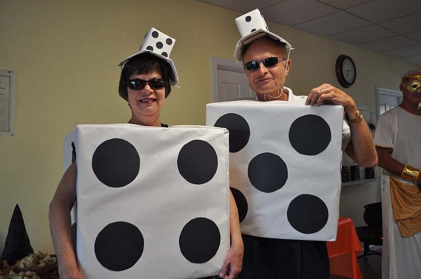 Linda and Charlie Czech spent all day putting together their giant dice costumes.