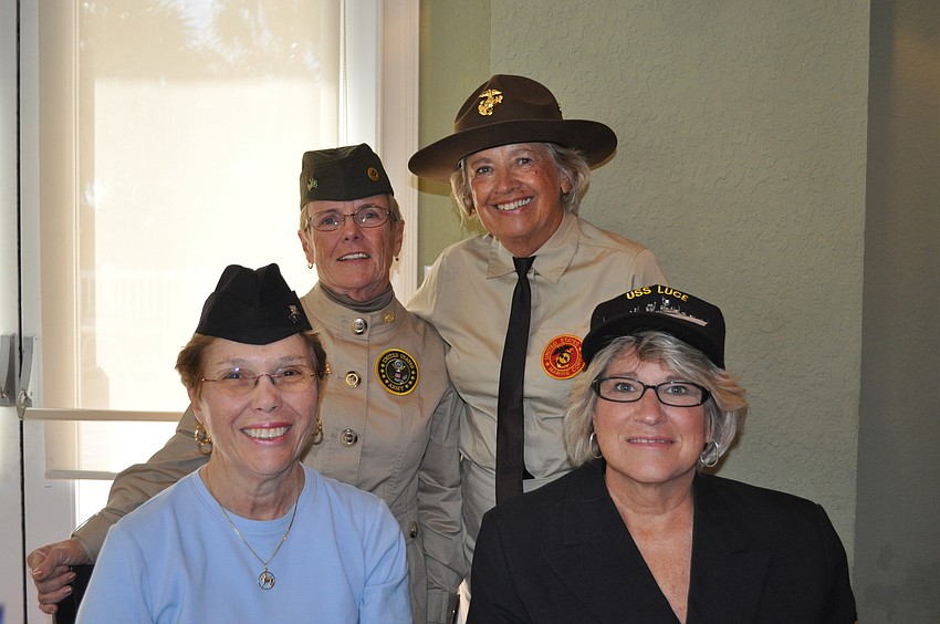 Hostesses Barbara Tierney. Joan Hoffman, Sandy Reardon and Nancy Thompson represent the four branches of the military.