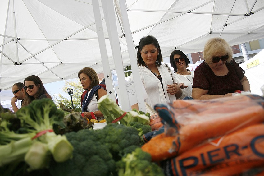 Eager customers lined up early to get the best produce.
