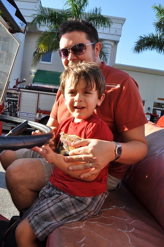 Remy De Paris and his dad, Bryan, got a feel for driving a fire truck.