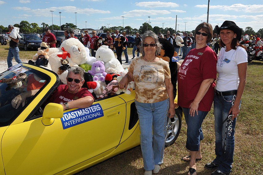 Kids by the Sea President Jim Miles, left, rode in style at this year's event.