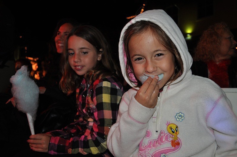 Six-year-old Lauren Consiglio, right, feasted on cotton candy from her front row seat for the ceremony.