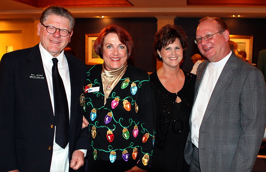 Fleet Captain Bill Jacobs, Rebecca Taylor, Pastor Mark Bernthal and Cyndi Bernthal pose together at the Bird Key Yacht Club on Saturday, Dec. 4.