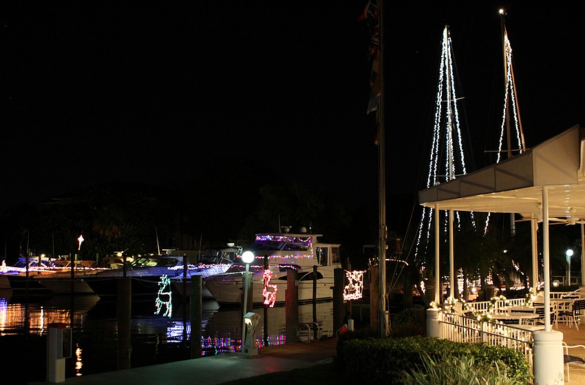 Boats owned by Bird Key Yacht Club members illuminate the dock during the Lighting of the Fleet evening, Saturday, Dec. 4.