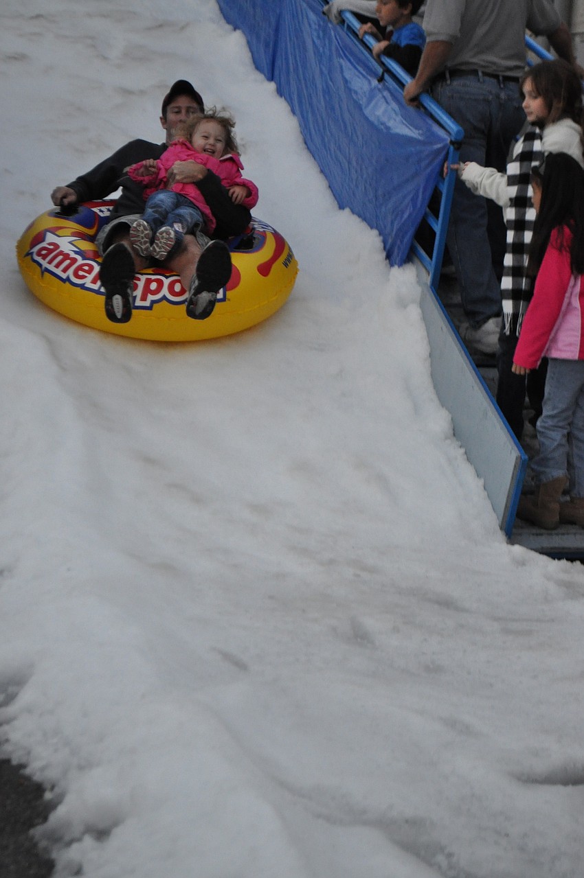 Leyna Mcintire-Simmons takes a ride with her father, Brett Simmons.