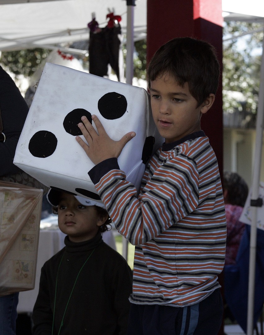 Second-grader Tyler House tried his luck at the dice game.