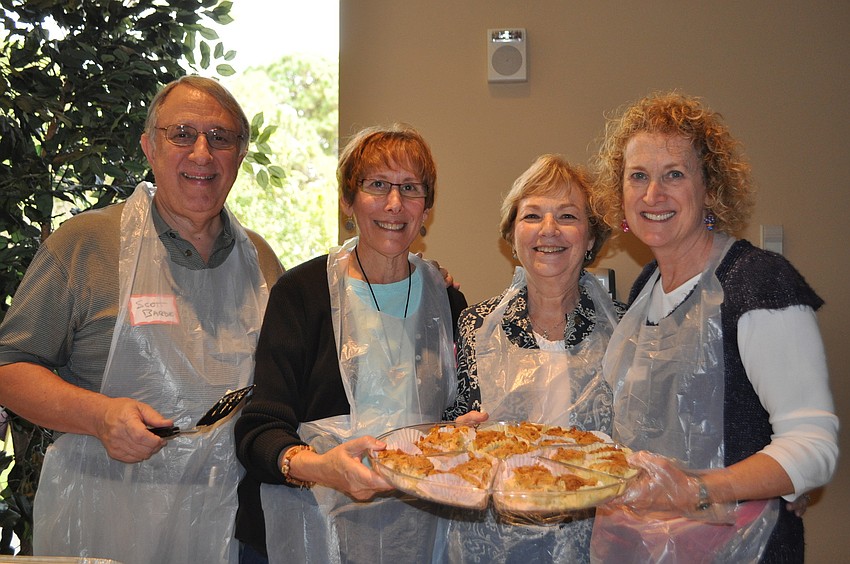 Scott and Judy Barde, Harriet Gersman and Elyse Diamond serving cheese blintzes and fruit kugel.
