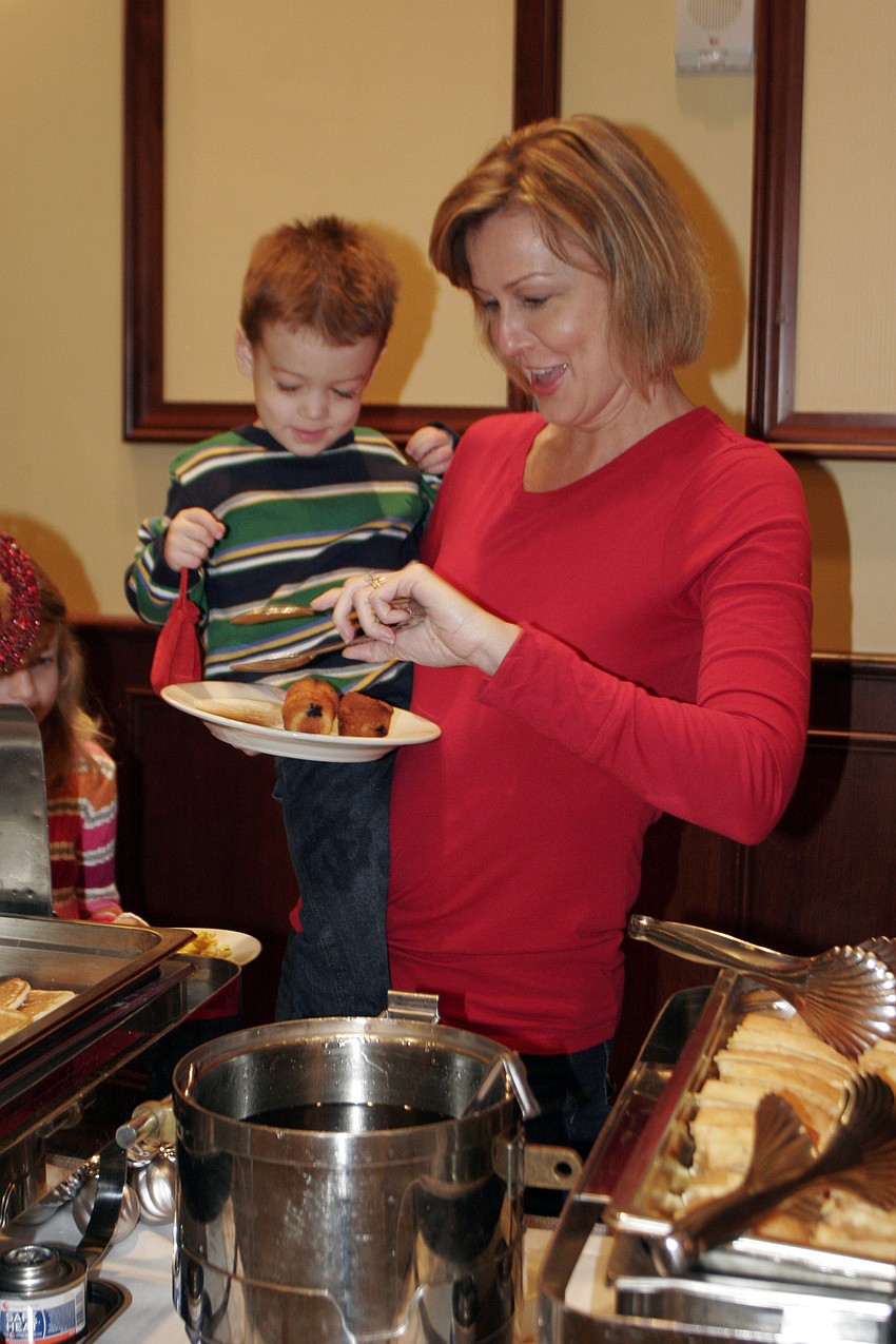 Heather O'Neill and her 3-year-old son, Collin, enjoyed a hearty breakfast before seeing Santa.