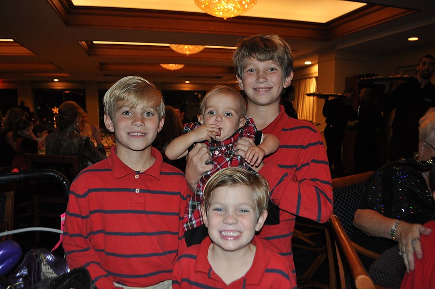 John, Gerrit and Kevin McConnin with their baby sister, Lindsay