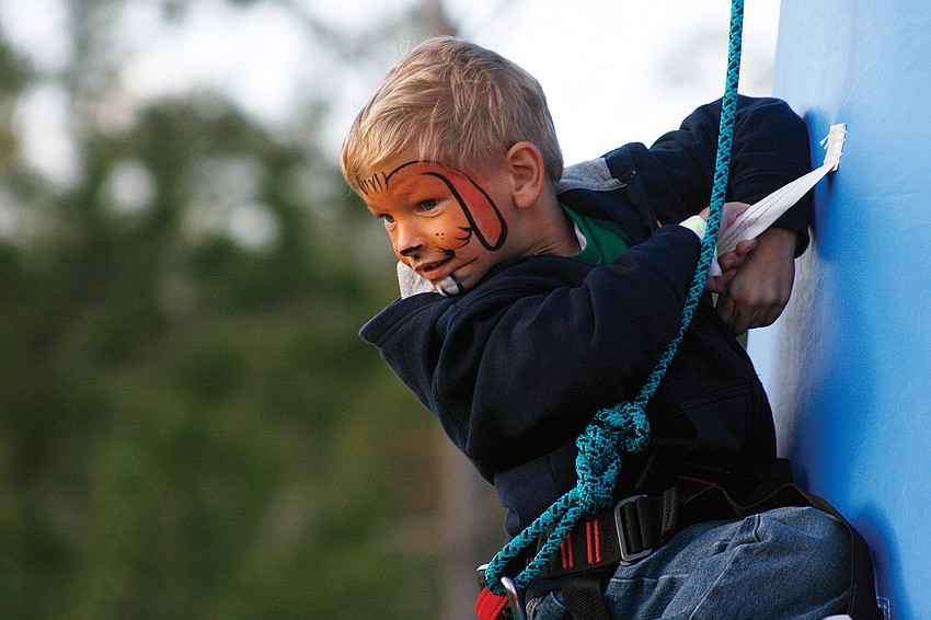 Trey Wandall conquered this inflatable climbing course at the Mark Wandall Foundation Family Fun Night. Published Nov. 11.