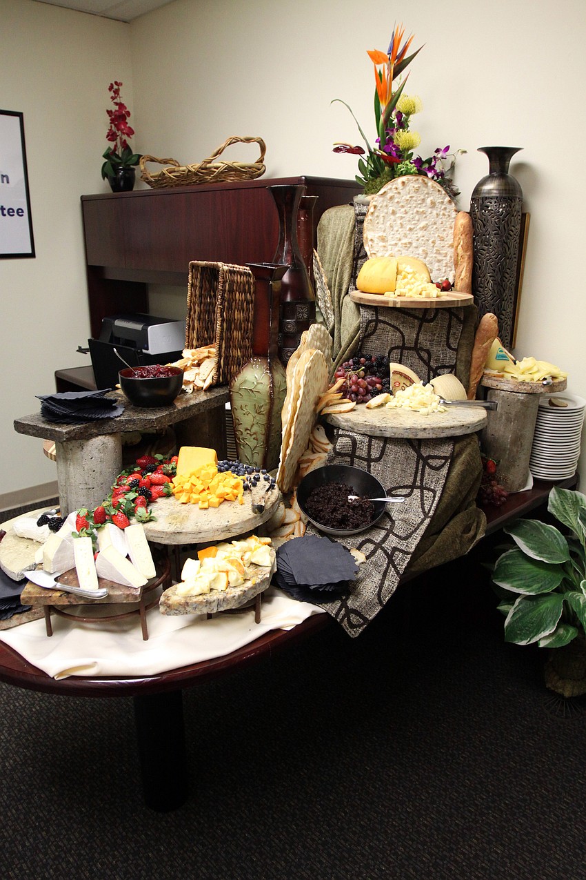 A table was filled with a variety of cheeses for people to enjoy during the party at the AJCâ€™s new office party on Thursday, Jan. 6.
