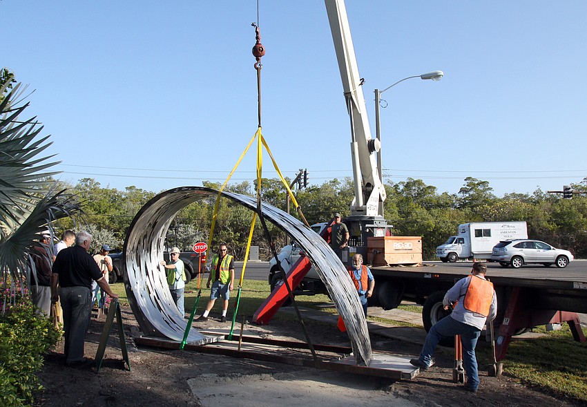The Wave 2 Me sculpture gets put into place at the entrance to Longboat Key Club and Resort Islandside. The sculpture was previously located at the Longboat Key Center for the Arts.
