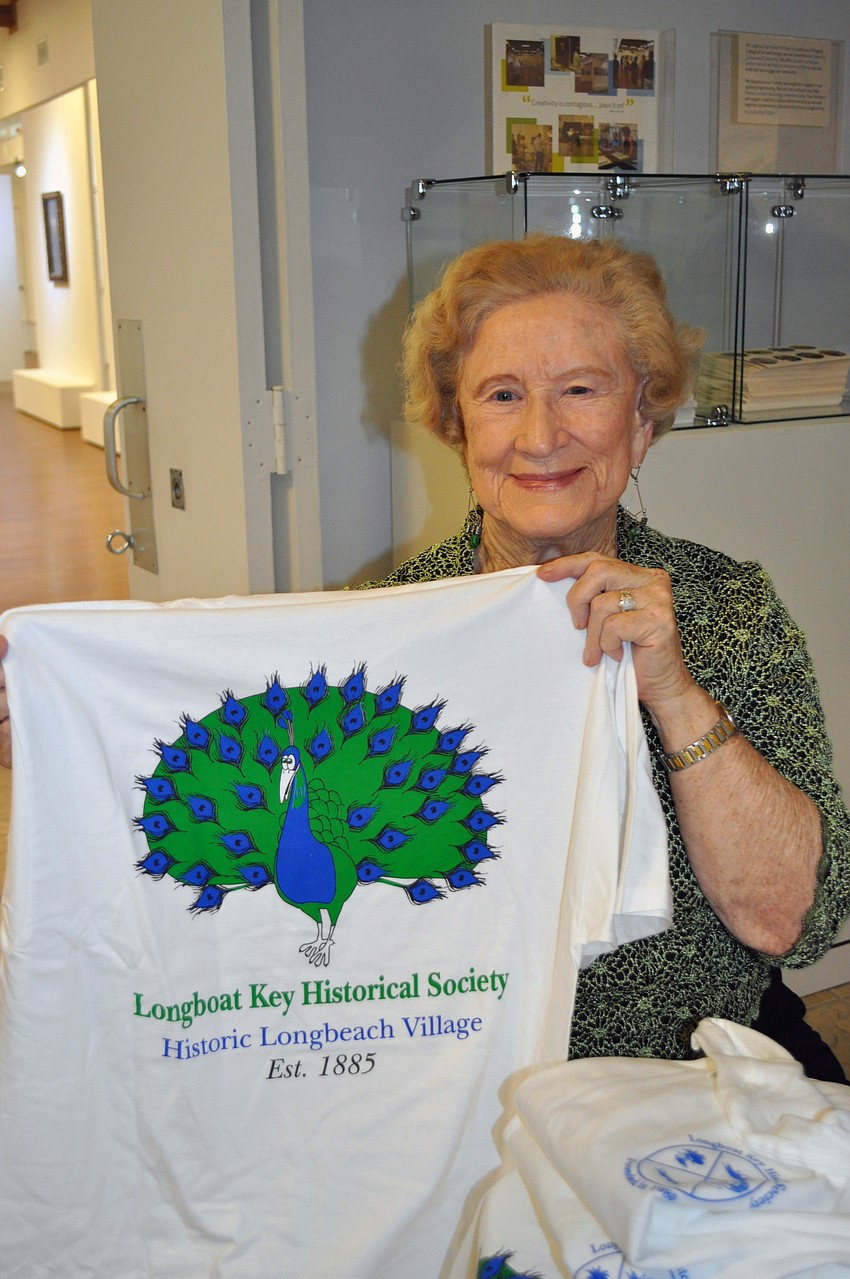 Evey Huntington sells Historical Society t-shirts