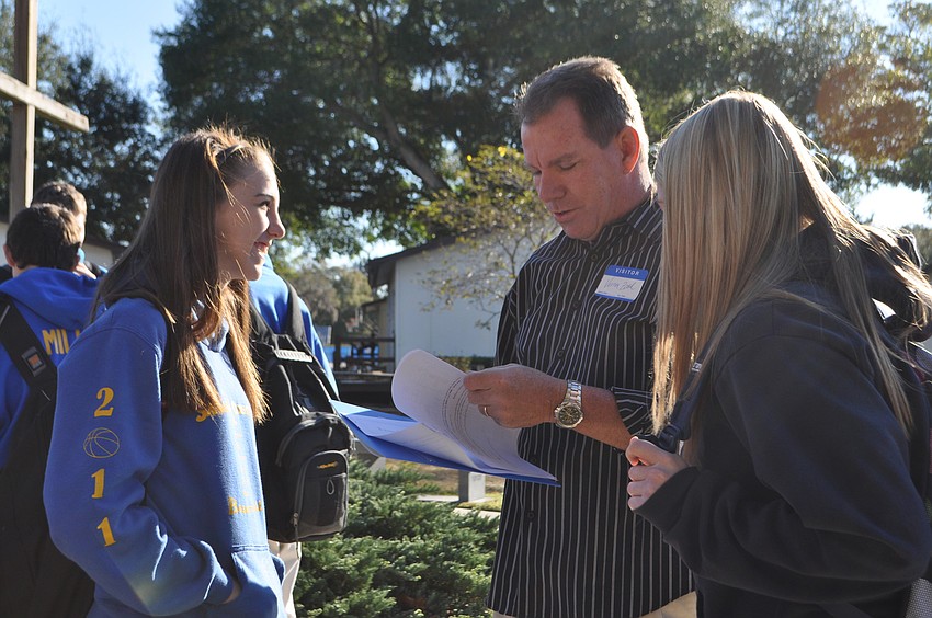Paige Troyer, Pastor at Abundant Life Church, Vernon Zook, and Bethany Garriott