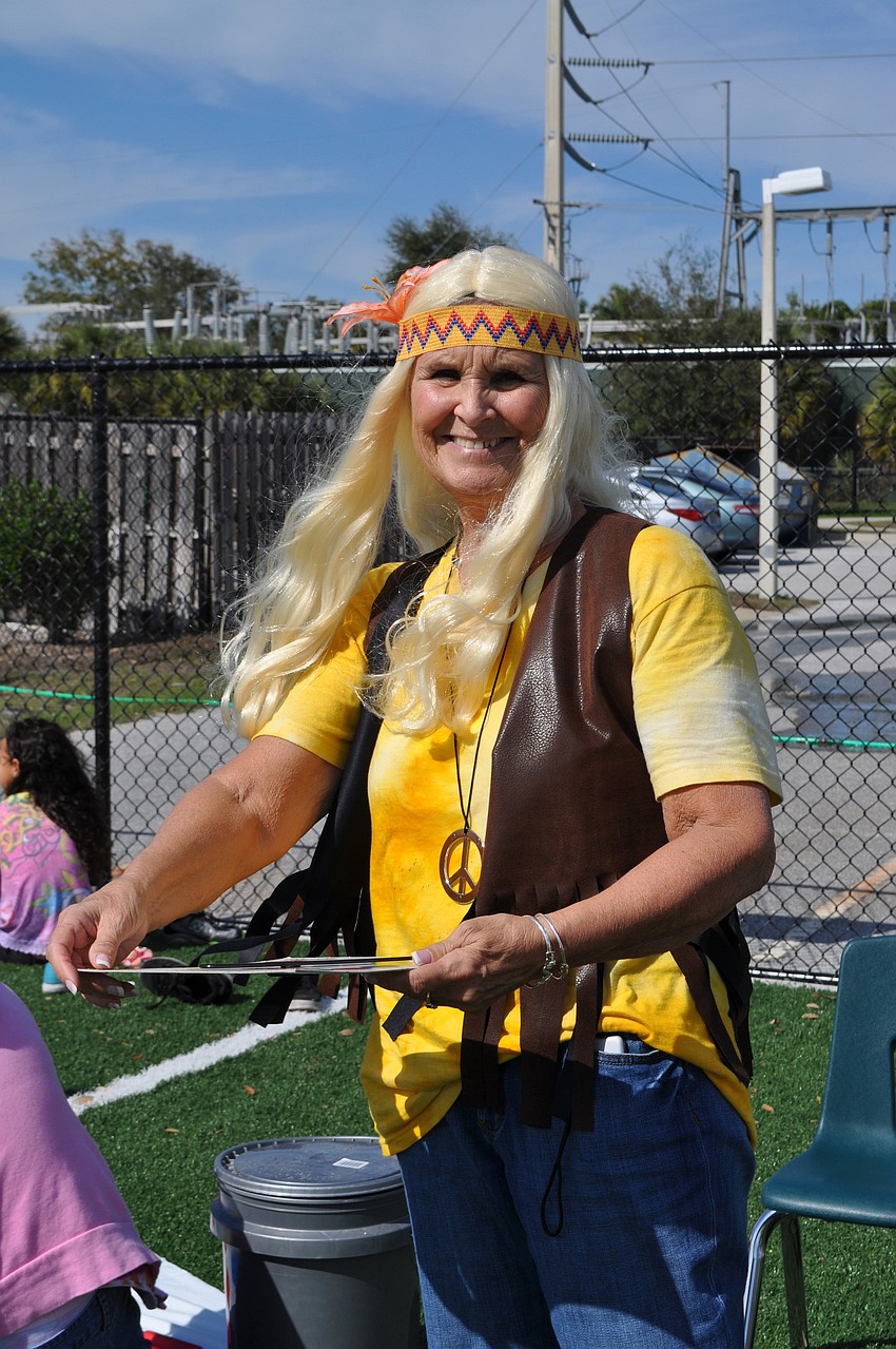 Cynthia McGrail leads students in a game of Twister.