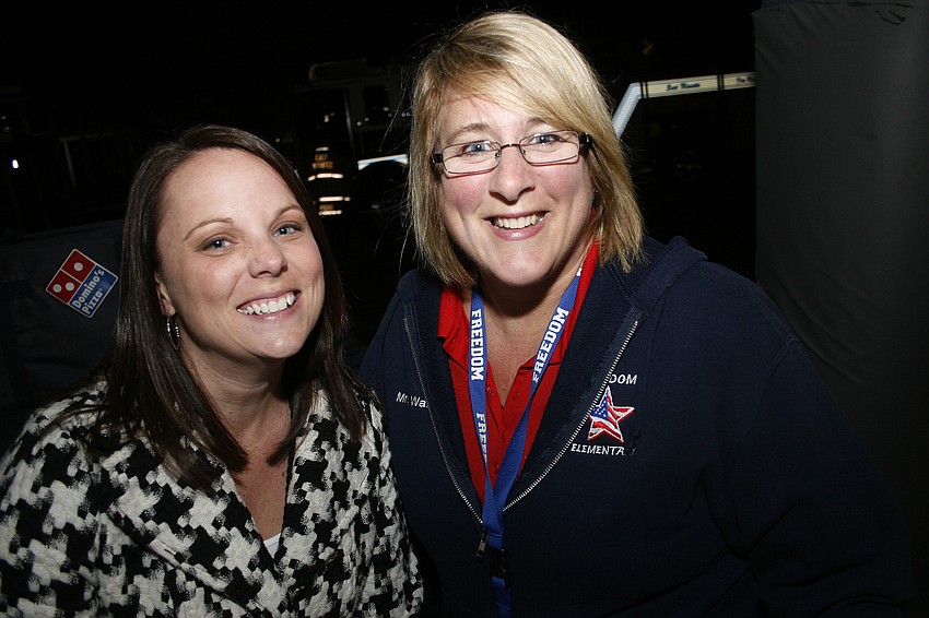 First-grade teachers Alison McLeod and Ruth Ann Watts sold pizza at the Bonfire.
