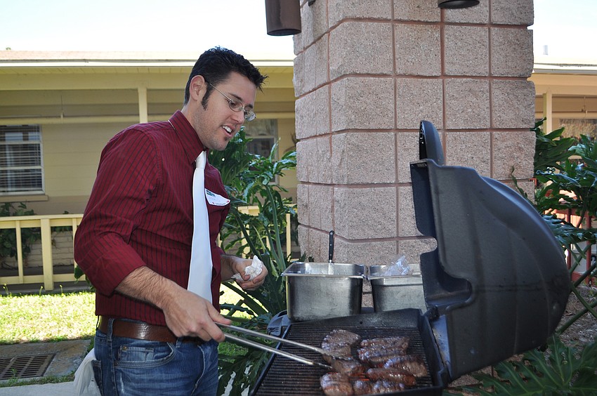 Frank Maggio grills up steaks for the residents.