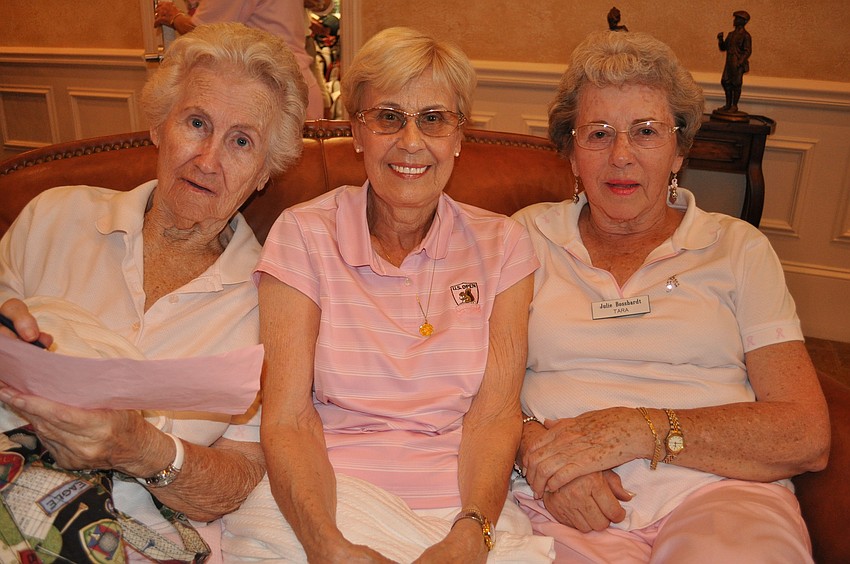 Chris Wolsin, Gloria DeVries and Julie Bosshardt checked out their scores before lunch.