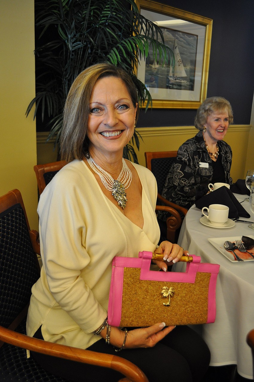 Teresa Ribaudo won this Diana E. Kelly purse in one of the event's many raffles.