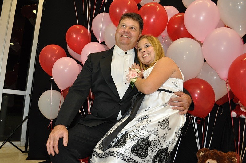 Chris Makal and his daughter Skylar, 9, were sure to get their picture taken.