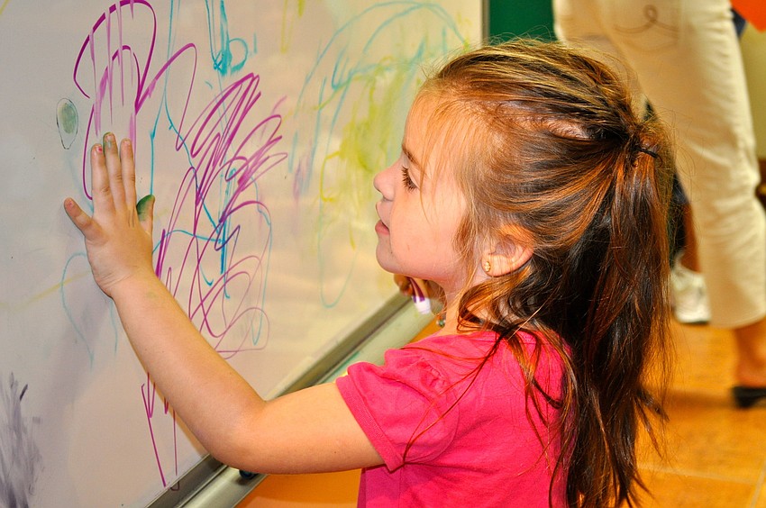 Lucy Perales displays her art skills.