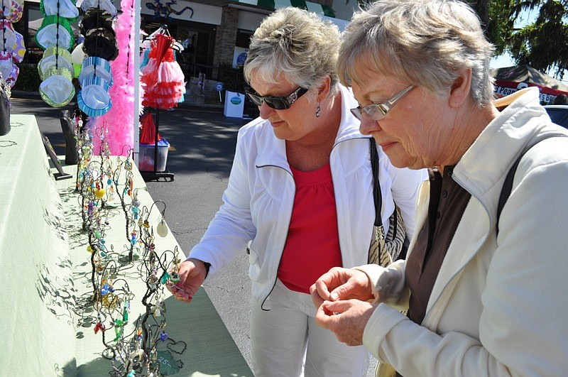 Monica Maguire, back, and Maureen Barlow scoped out the earring selection at a booth.