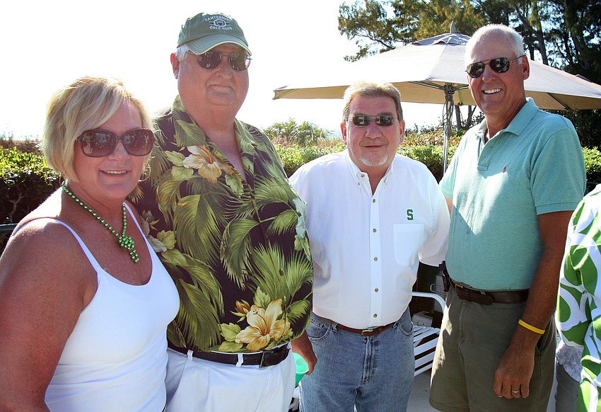 Ann and Bob Crump with Cedars West President, Ross Alander, and Rob Gibby on Thursday, March 17 during Cedars West's St. Patrick's Day party.