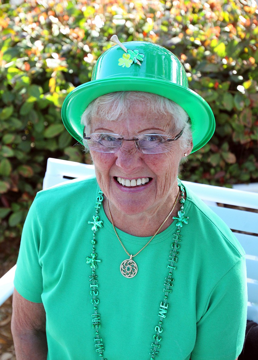 Barbara Kucharski decorated her plastic, green bowler hat with shamrock stickers and a golf tee.