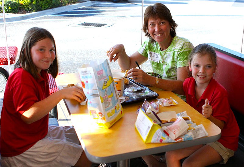 Lillie, 9, Susan and Rose, 7, at McTeacher's Night.
